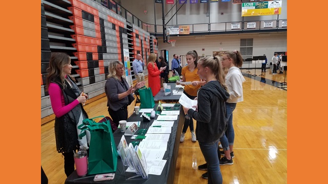 gym full of tables and students